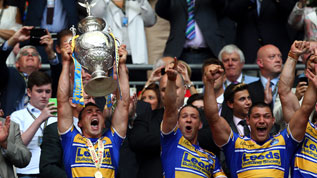 Kevin Sinfield lifts the Challenge Cup trophy