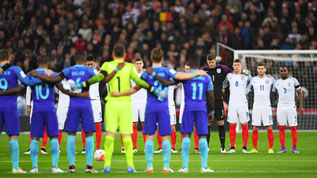 England and Netherlands players stand together for a minute's silence