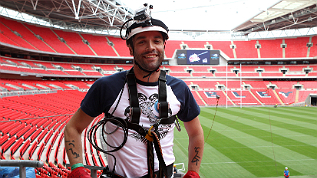 Chris from Muse after taking the zip wire across Wembley Stadium
