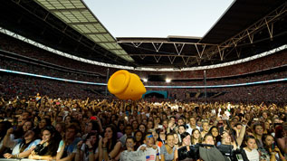 A giant duck bounces around the crowd at the 2014 Capital Summertime Ball