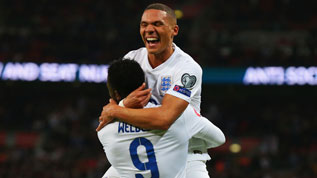 Welbeck celebrates his second goal against Slovenia