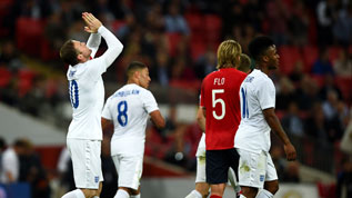 Rooney celebrates his goal against Norway