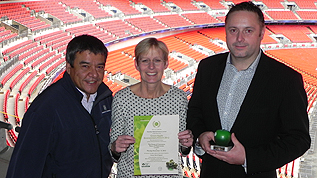 Sustainability Manager for Wembley Stadium, James Huartson and Green Team members Jane Baker and Henry Munro with the award