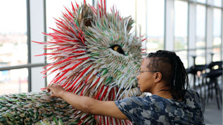 Artist Faith Bebbington puts the finishing touches to one of the lions